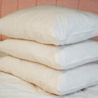 minnesota-wooly-bolas-pillows-stack